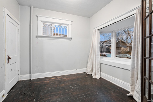 empty room featuring dark hardwood / wood-style floors