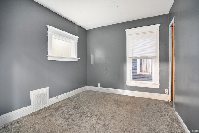 unfurnished room featuring carpet floors