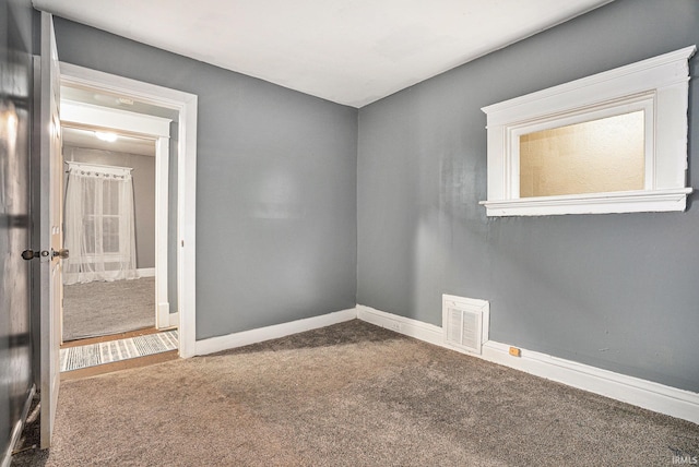 unfurnished room with carpet flooring