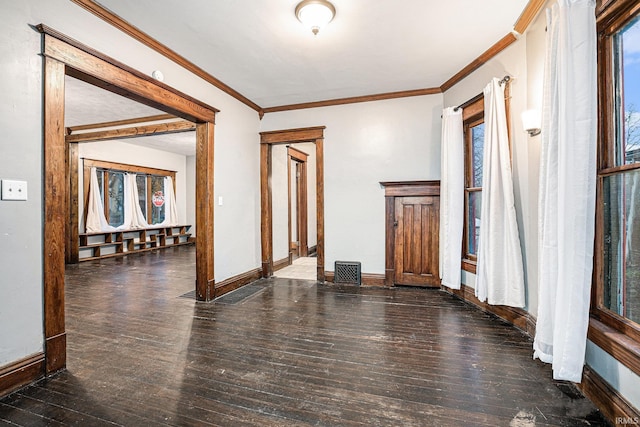 entryway featuring ornamental molding and dark wood-type flooring