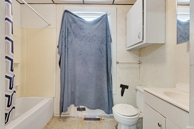 full bathroom featuring toilet, vanity, and shower / tub combo with curtain