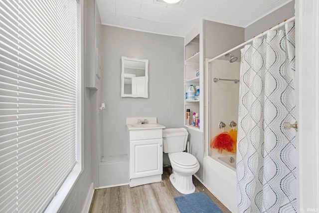 full bathroom featuring hardwood / wood-style floors, toilet, vanity, and shower / tub combo with curtain