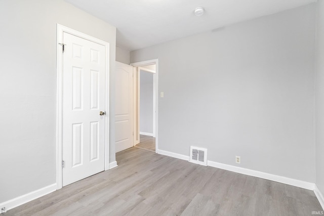 unfurnished bedroom featuring light wood-type flooring