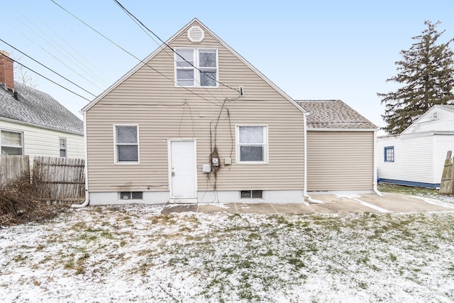 view of snow covered house