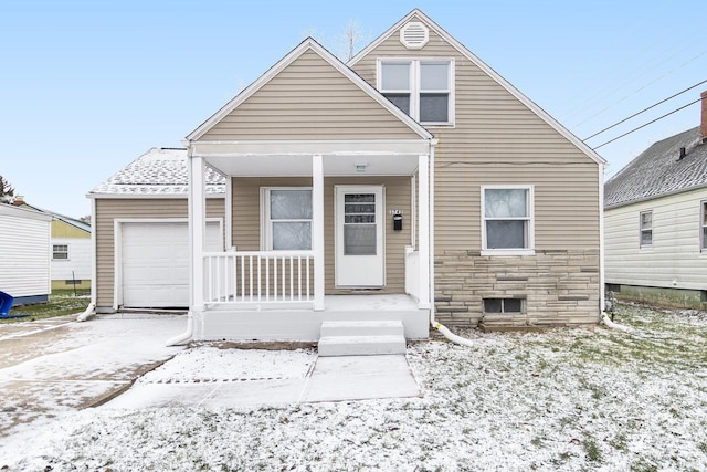 view of front facade with covered porch and a garage