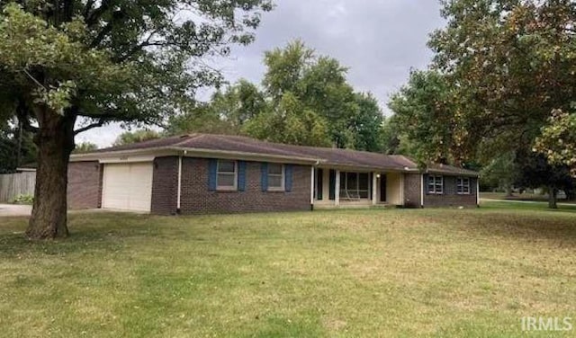 ranch-style house with a garage and a front yard