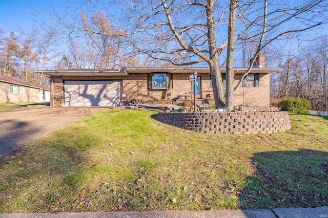 single story home featuring a front yard and a garage