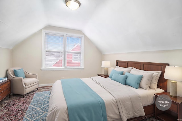 bedroom featuring lofted ceiling