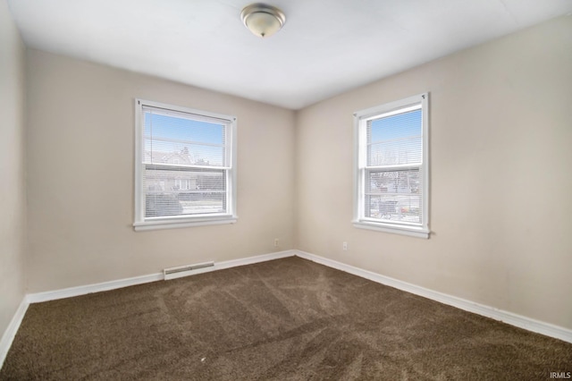 unfurnished room featuring carpet and plenty of natural light