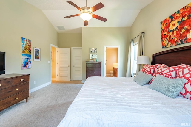 carpeted bedroom featuring ensuite bathroom, ceiling fan, and vaulted ceiling