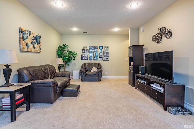 living room with light carpet and a textured ceiling