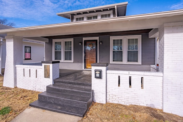 doorway to property featuring a porch