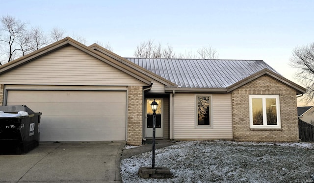 ranch-style house featuring a garage