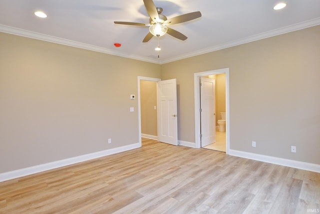 unfurnished bedroom featuring ensuite bath, ceiling fan, and crown molding