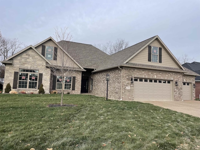 view of front of house with a front yard and a garage