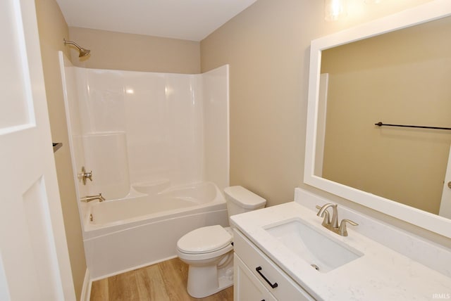 full bathroom with vanity, shower / bathing tub combination, wood-type flooring, and toilet