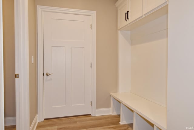 mudroom with light hardwood / wood-style floors