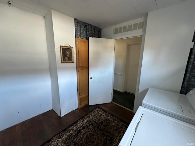 laundry area with washer / clothes dryer and dark hardwood / wood-style flooring