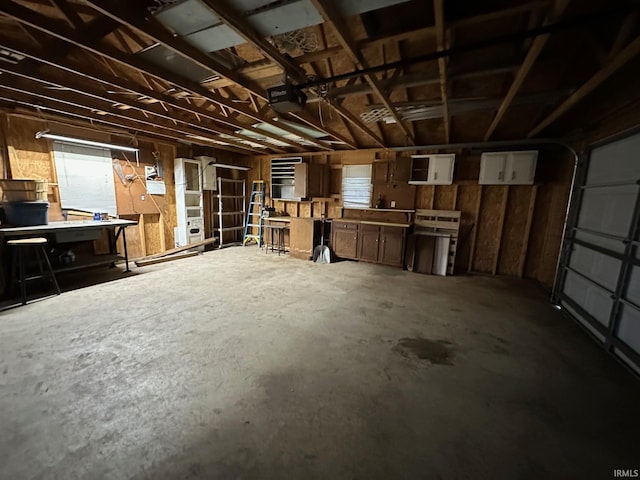 interior space featuring a workshop area and a garage door opener