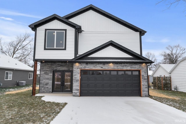 view of front of home with central air condition unit and french doors