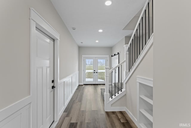 doorway to outside featuring hardwood / wood-style flooring and french doors