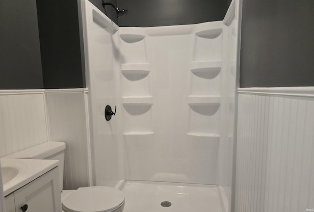 bathroom with vanity, toilet, and walk in shower