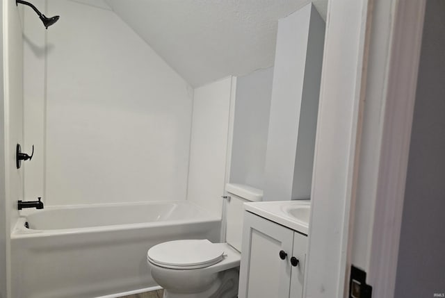 full bathroom with a textured ceiling, vanity, shower / washtub combination, toilet, and lofted ceiling