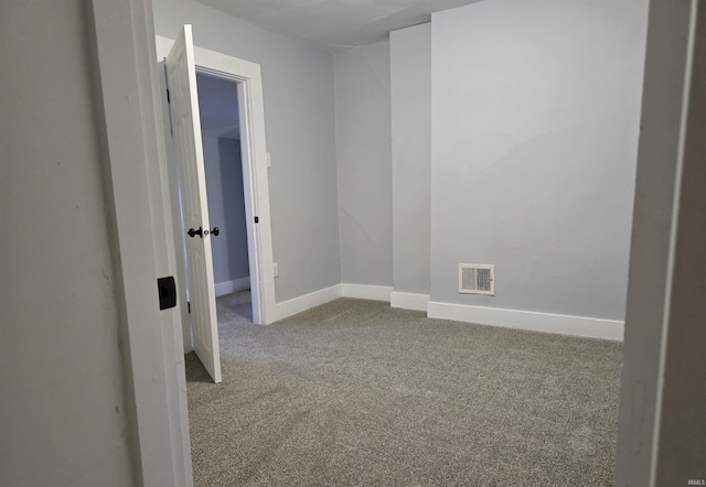 spare room featuring carpet flooring