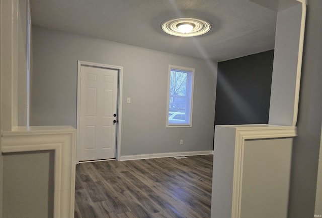 foyer entrance featuring dark hardwood / wood-style floors