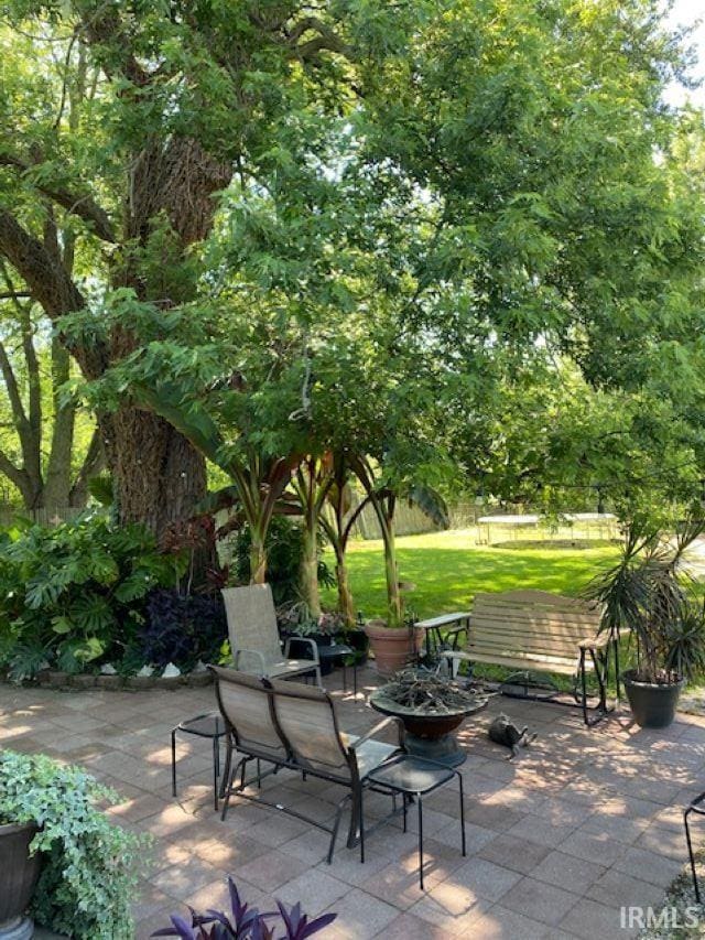 view of patio with an outdoor fire pit