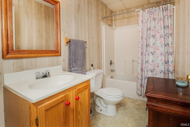 full bathroom featuring vanity, shower / bath combination with curtain, toilet, and wooden walls