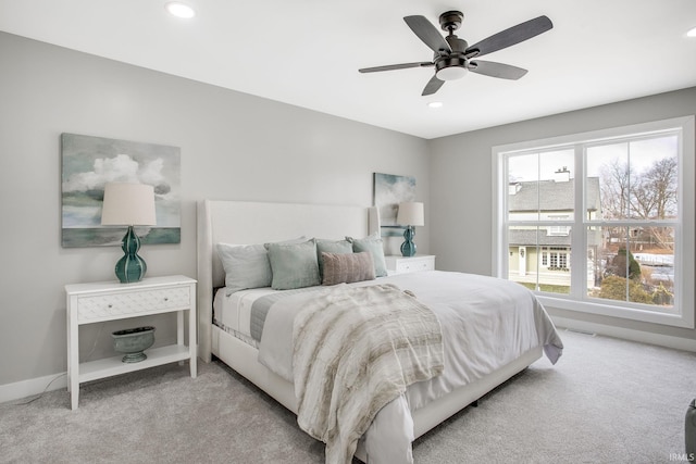 carpeted bedroom featuring ceiling fan