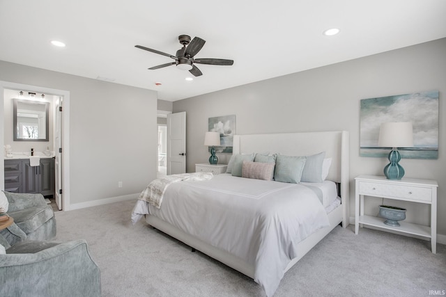 carpeted bedroom featuring connected bathroom and ceiling fan