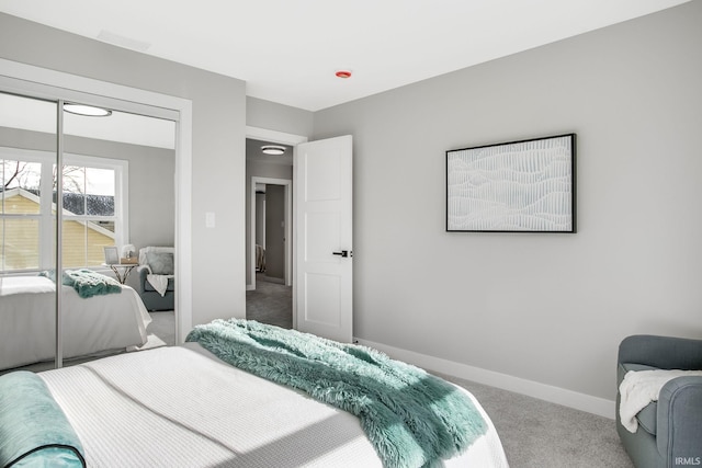 carpeted bedroom featuring a closet