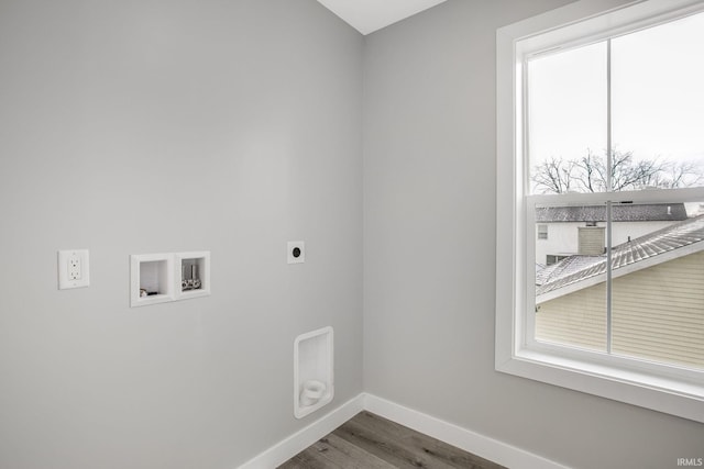 washroom featuring hookup for a washing machine, hardwood / wood-style floors, and hookup for an electric dryer