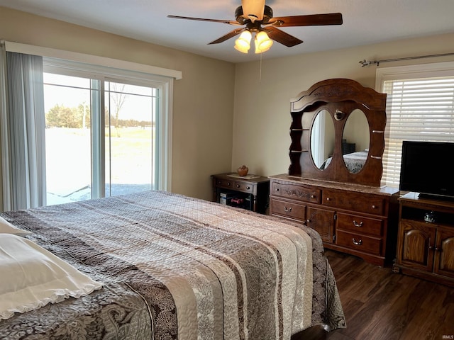 bedroom featuring ceiling fan, dark wood-type flooring, and access to outside