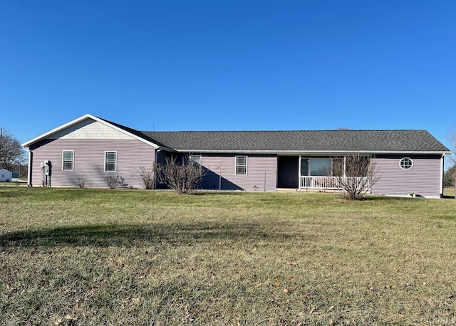 rear view of house with a lawn