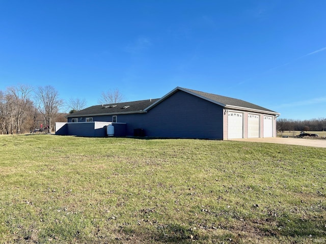 view of home's exterior featuring a garage and a yard