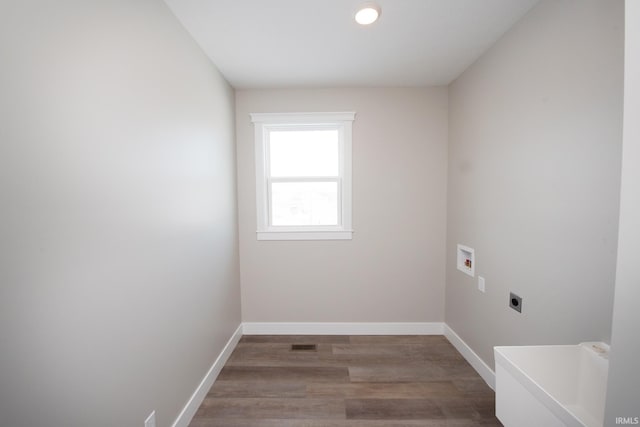 laundry room featuring washer hookup, hardwood / wood-style flooring, and electric dryer hookup