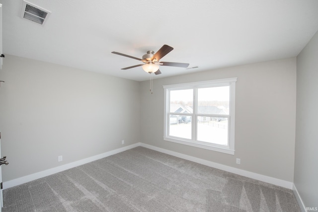 unfurnished room featuring ceiling fan and carpet floors