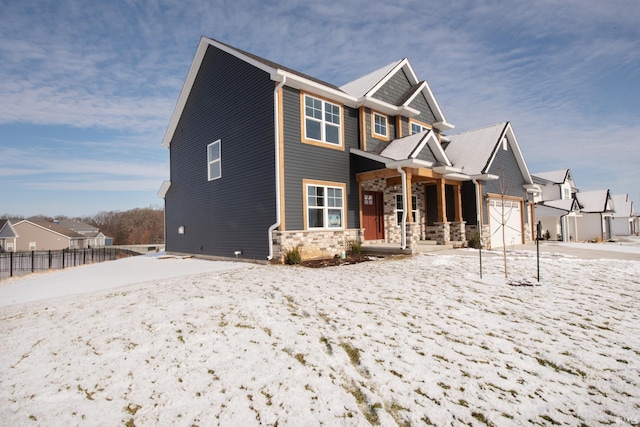 view of front of property with a porch and a garage