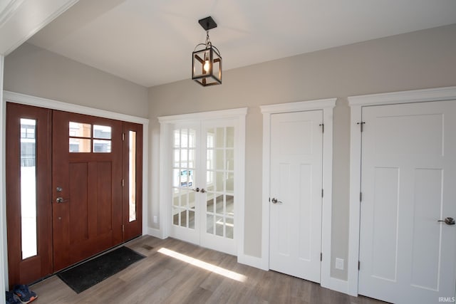 entryway featuring hardwood / wood-style floors and french doors