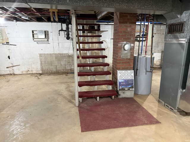 basement with heating unit and water heater