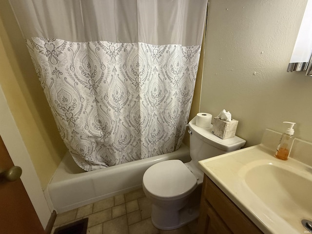 full bathroom with washtub / shower combination, tile patterned flooring, vanity, and toilet