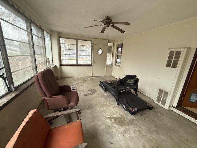 interior space with ceiling fan