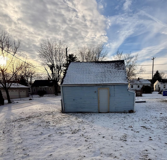 view of snow covered garage