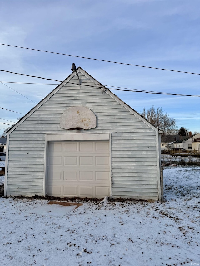 view of snow covered garage