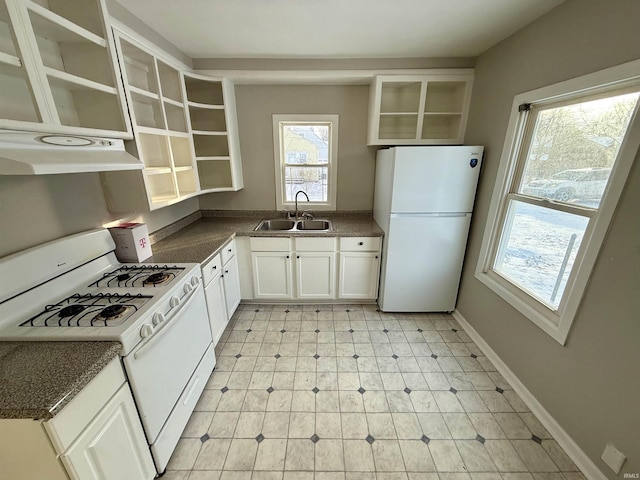 kitchen with white cabinets, white appliances, range hood, and sink