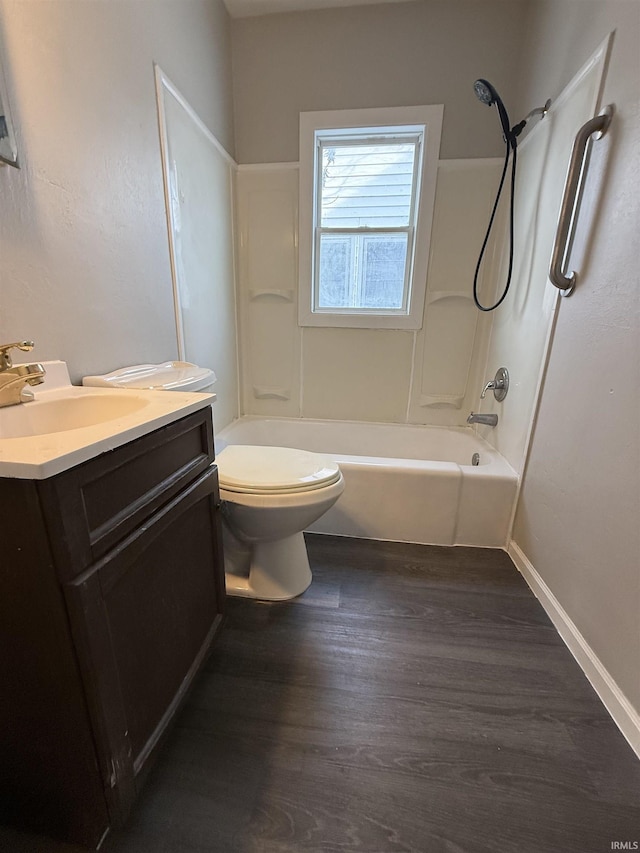 full bathroom featuring hardwood / wood-style flooring, vanity, toilet, and shower / tub combination