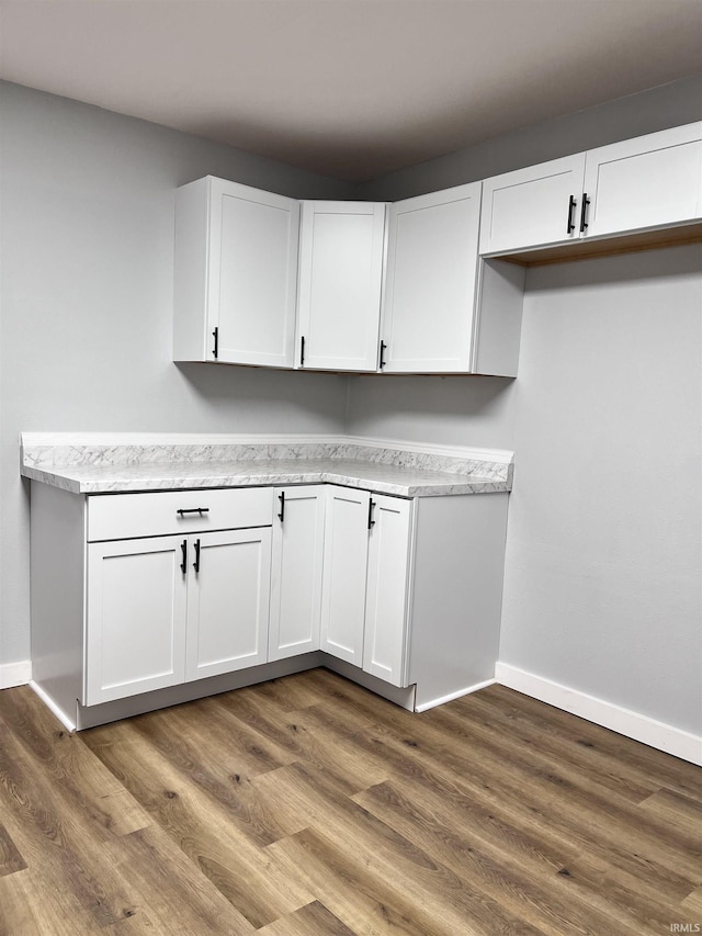 laundry room featuring dark hardwood / wood-style flooring